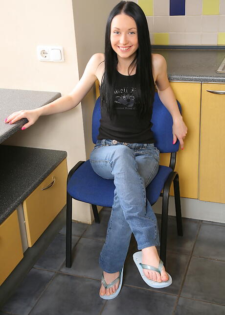 Hot brunette teen Nella exhibiting tiny tits and jerking off in the kitchen