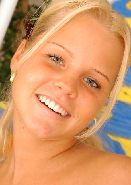 Luscious blond young Michaela in shorts exposes tiny tits and masturbates 